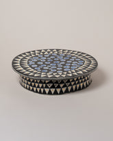 Suzanne Sullivan You'll Have To Distort It Cake Stand on light color background.