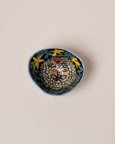 Suzanne Sullivan Leo Zodiac Sign Small Bowl on light color background.