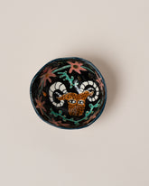 Suzanne Sullivan Aries Zodiac Sign Small Bowl on light color background.