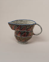 Suzanne Sullivan Albeit On The Sky Pitcher on light color background.