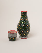 Suzanne Sullivan Fix A Rendezvous Carafe & Cup on light color background.