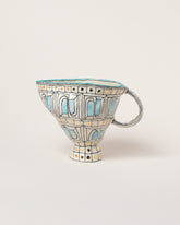 Suzanne Sullivan Mirror Of All Graciousness Pitcher on light color background.