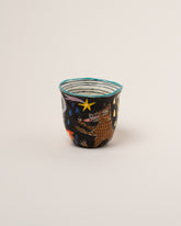 Suzanne Sullivan Four The Long Journey Tumbler on light color background.