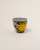 Suzanne Sullivan Twenty-Two The Long Journey Tumbler on light color background.