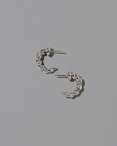 CRZM Sterling Silver Foothill Hoop Earrings on light color background.