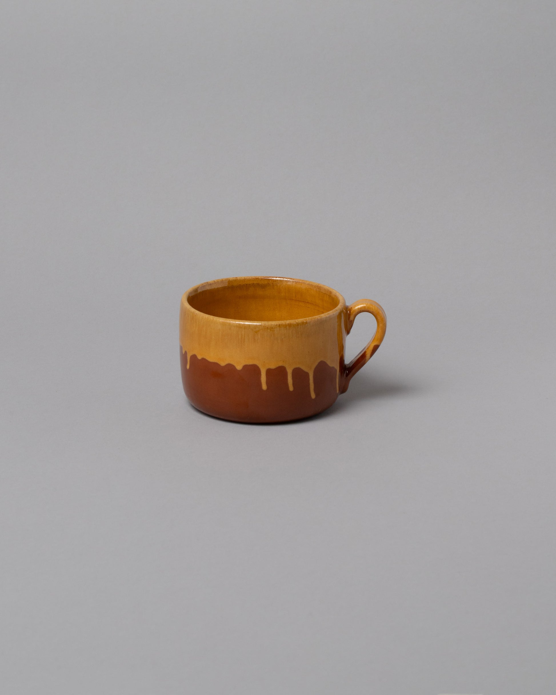 La Ceramica Vincenzo Del Monaco Caramel Yellow Tea Mug on light color background.