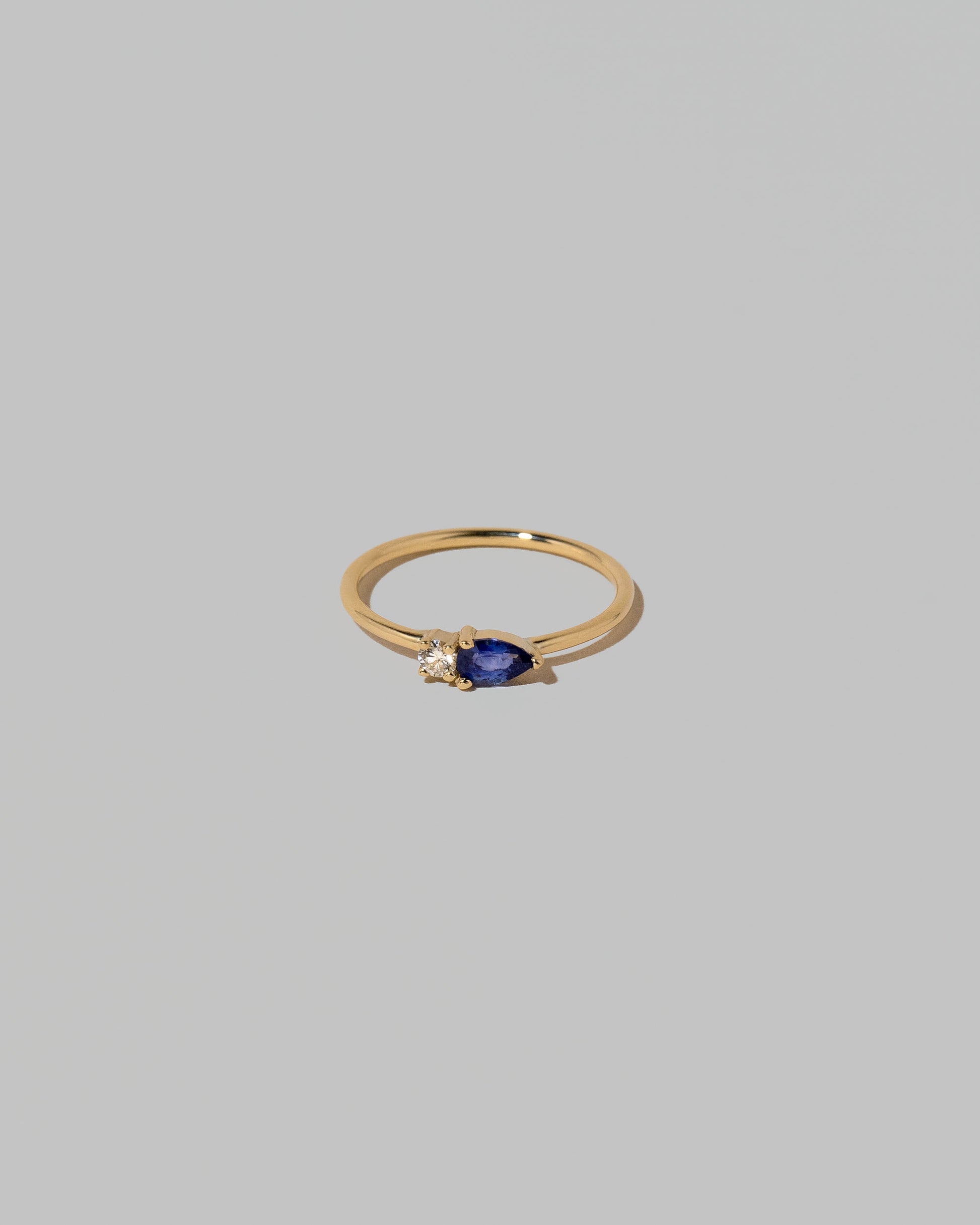 Blue Sapphire Teardrops Ring on light color background.