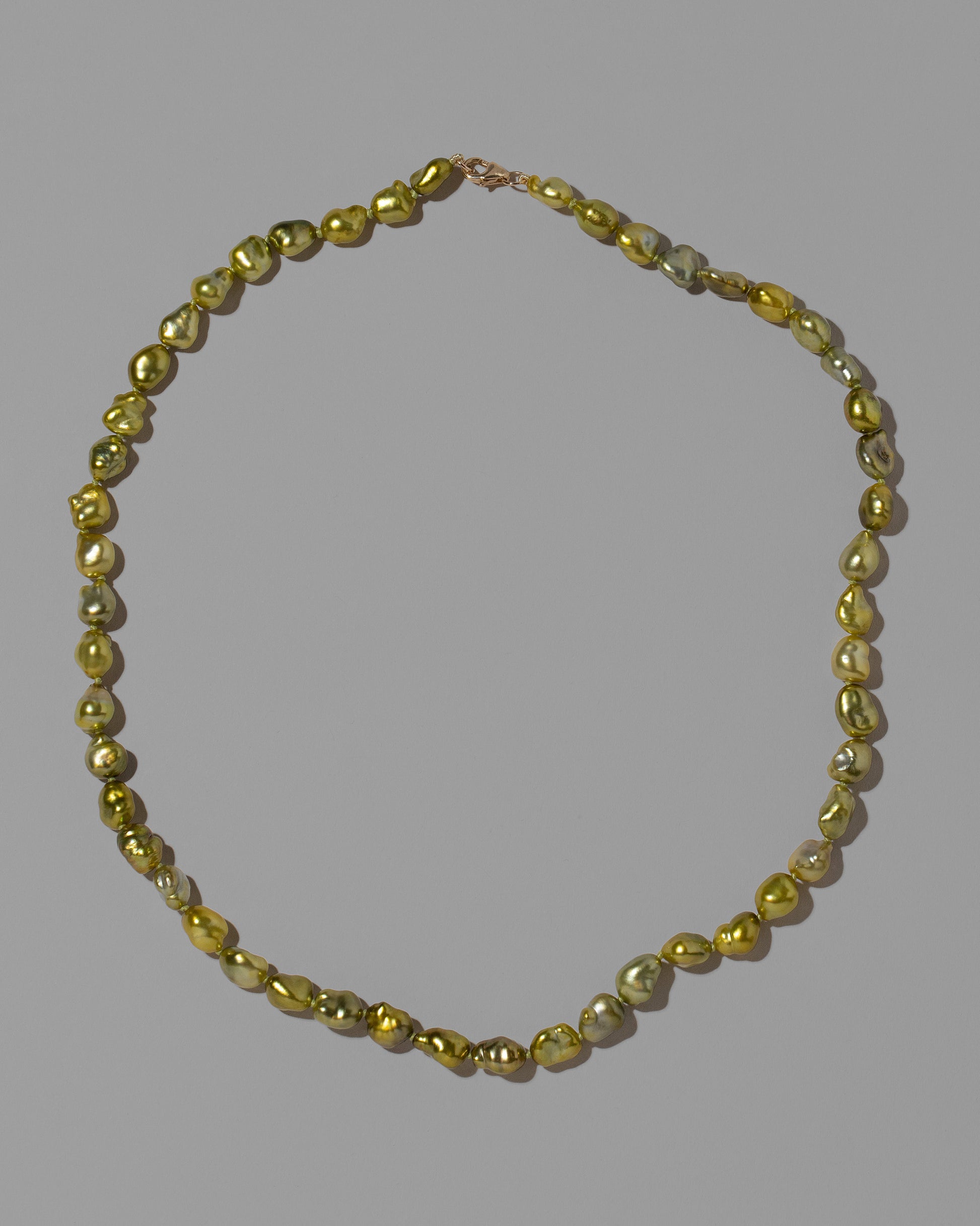 Brizo Necklace on light color background.