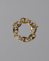 CRZM Gold Yuba Bracelet on light color background.