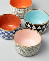 Group of Suzanne Sullivan Straight Sided Bowls on light color background.