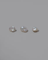 Natural Lagniappe Pearl Stud Earring Single on light color background.