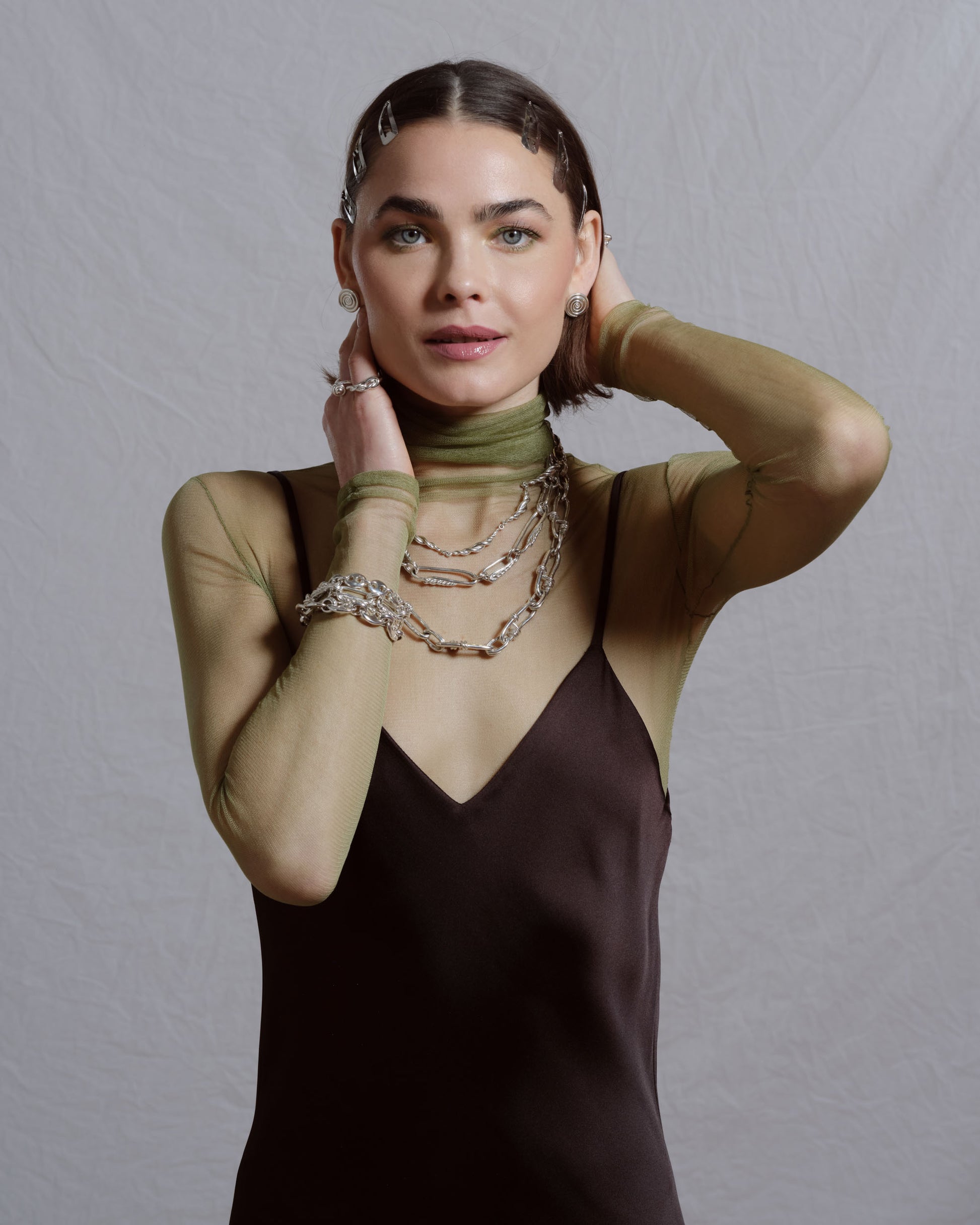Styled image featuring CRZM jewelry on model.