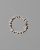 Terracotta Clay Thread Bubble Pearl Bracelet on light color background.