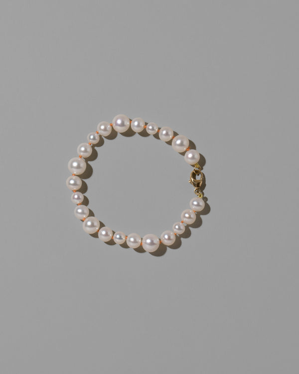 Terracotta Clay Thread Bubble Pearl Bracelet on light color background.