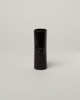 Bonam Kim Black Lip Pillar Vase on light color background.