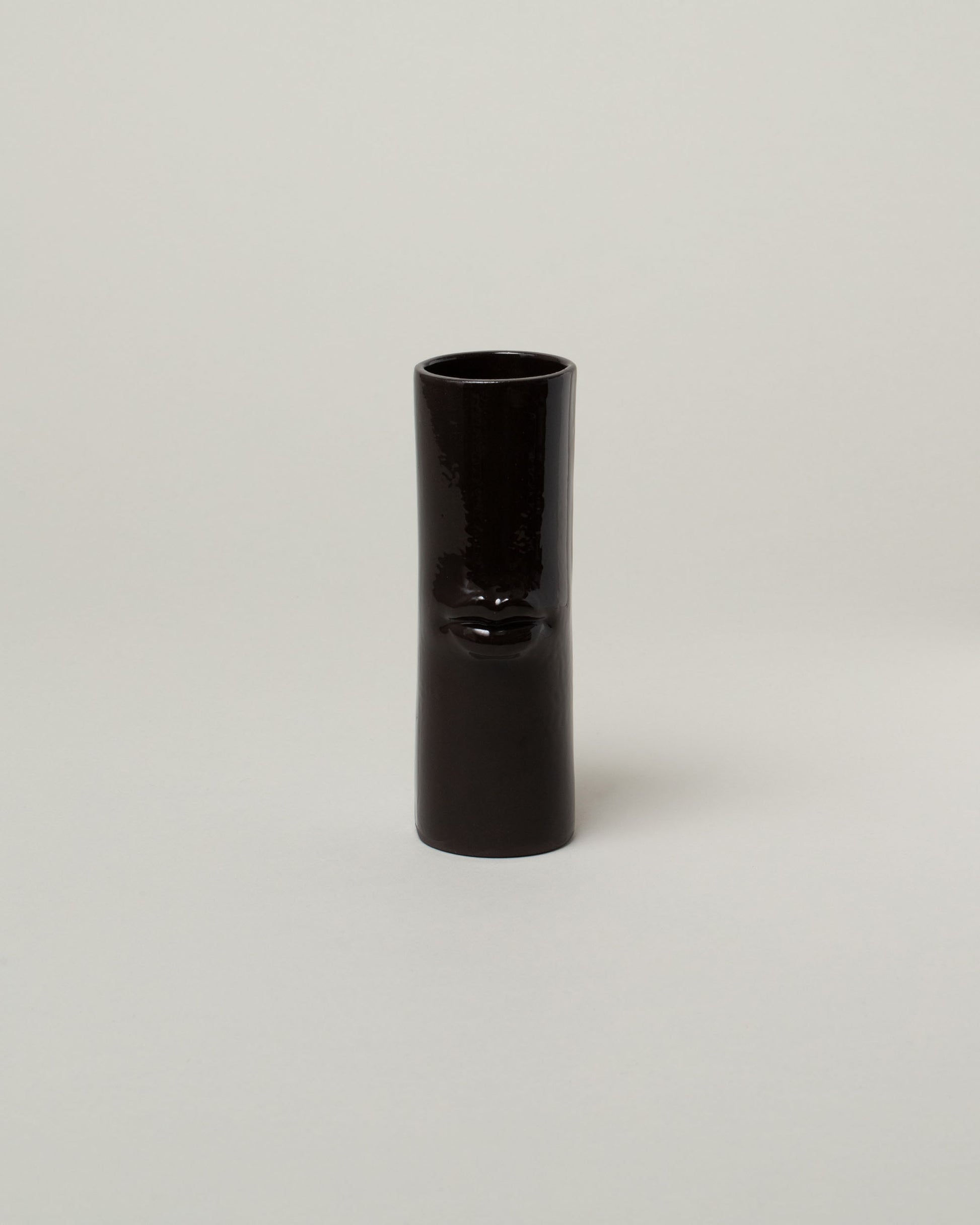 Bonam Kim Black Lip Pillar Vase on light color background.