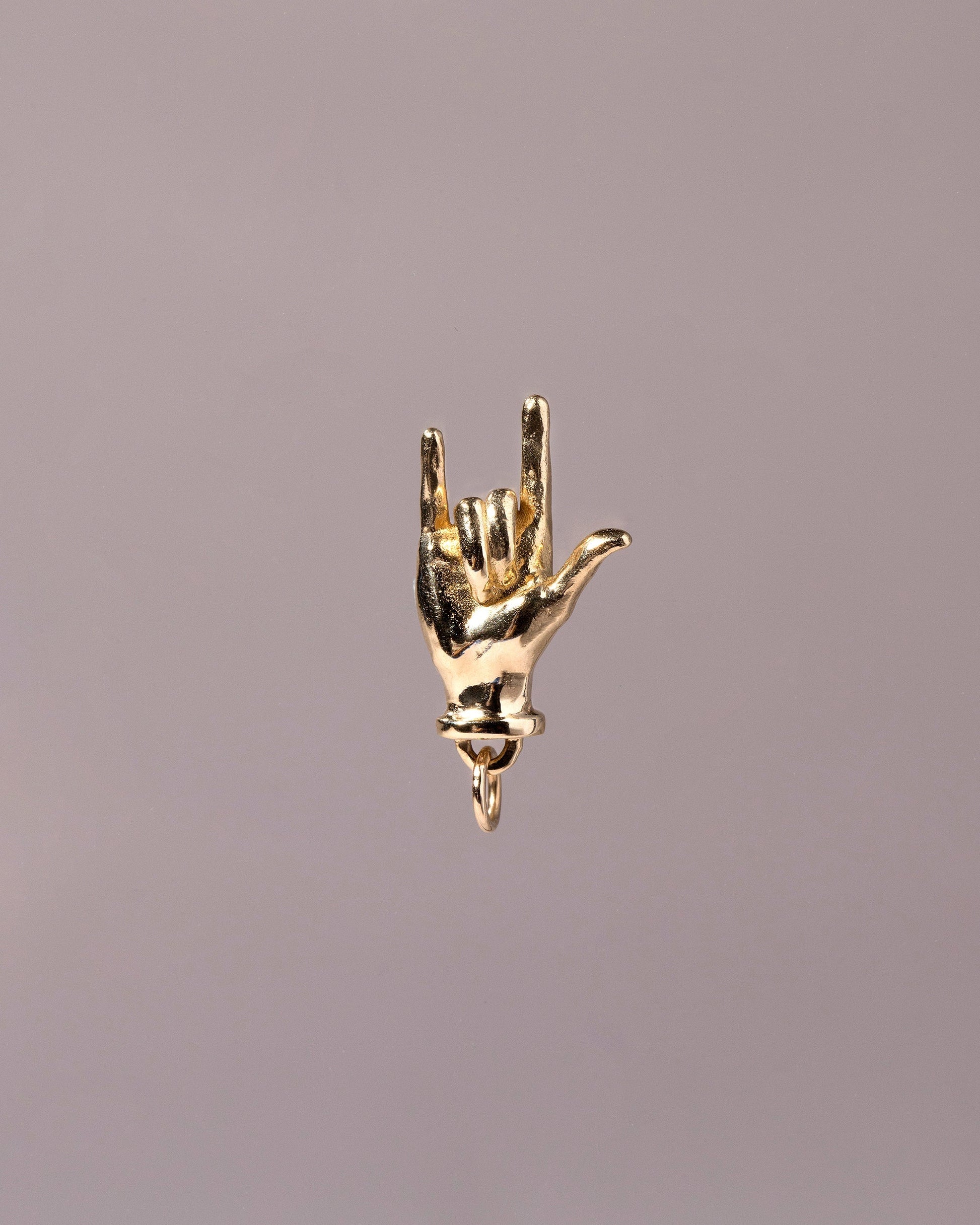 I Love You Sign Language Charm on light color background.