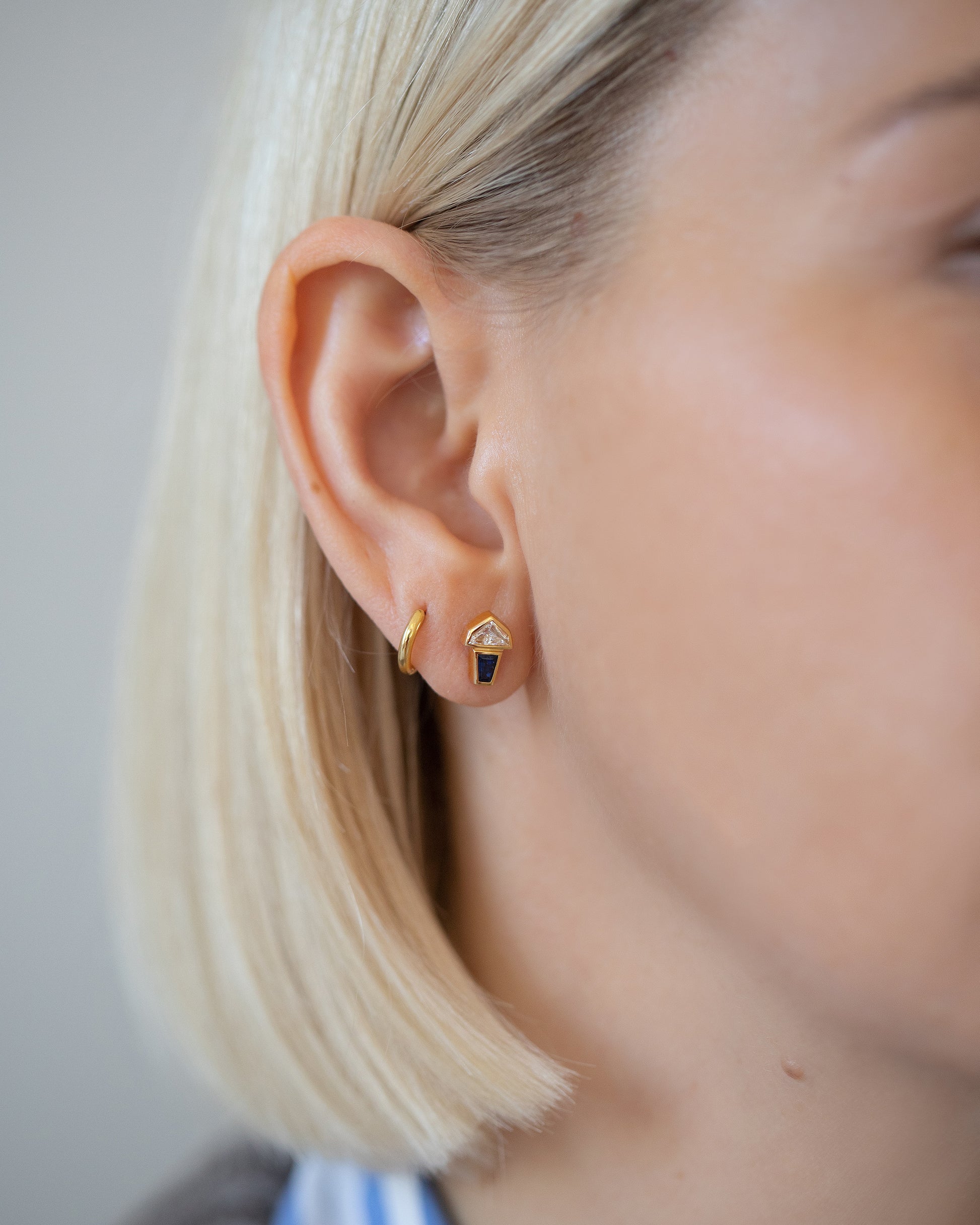 Vela Earrings on model.