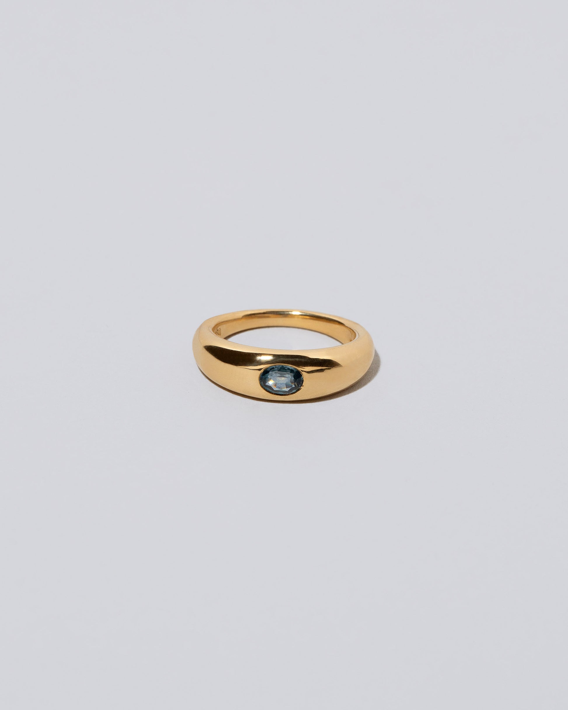 Blue Sapphire Venus Ring on light color background.