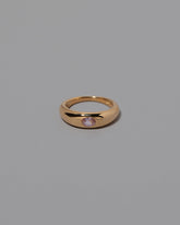 Pink Sapphire Venus Ring on grey color background.