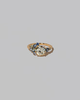 Diamond & Sapphire Vega Ring on light color background.