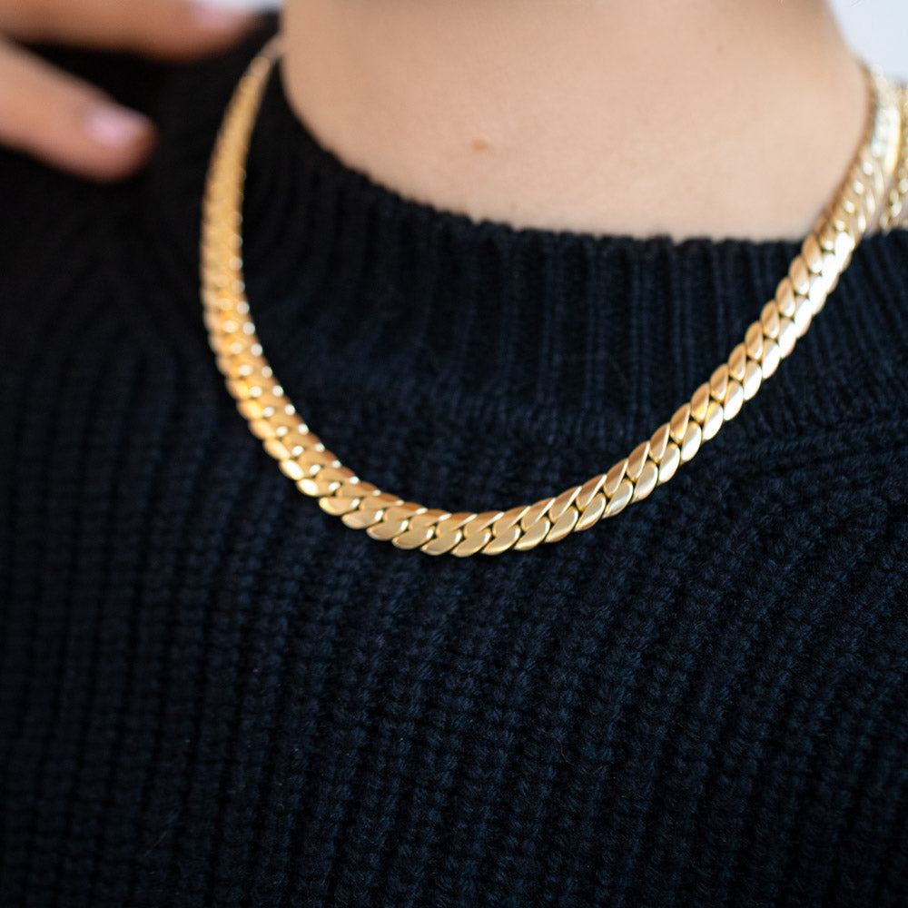 product_details::Vintage 18k Yellow Gold Cartier Flat Curb Chain Necklace on model.