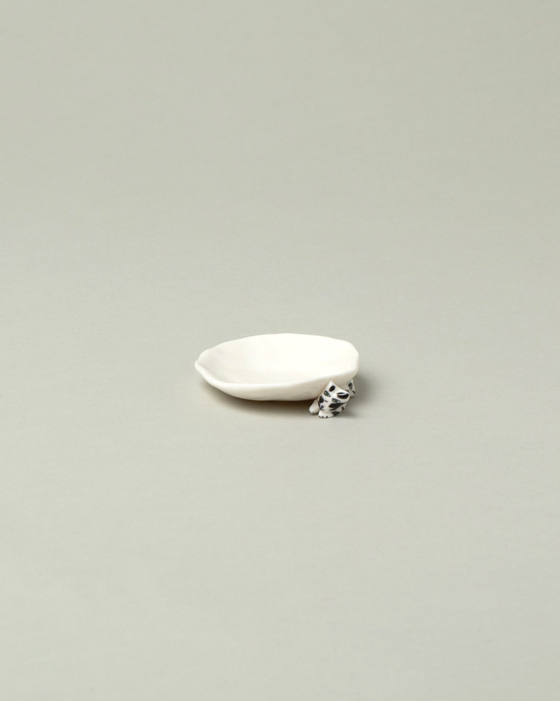 Eleonor Boström Black Spots Mini Cat Dish on light color background.
