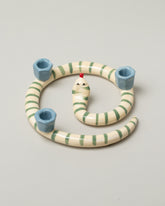 Laetitia Rouget Sneaky Dots Snake Candle Holder on light color background.