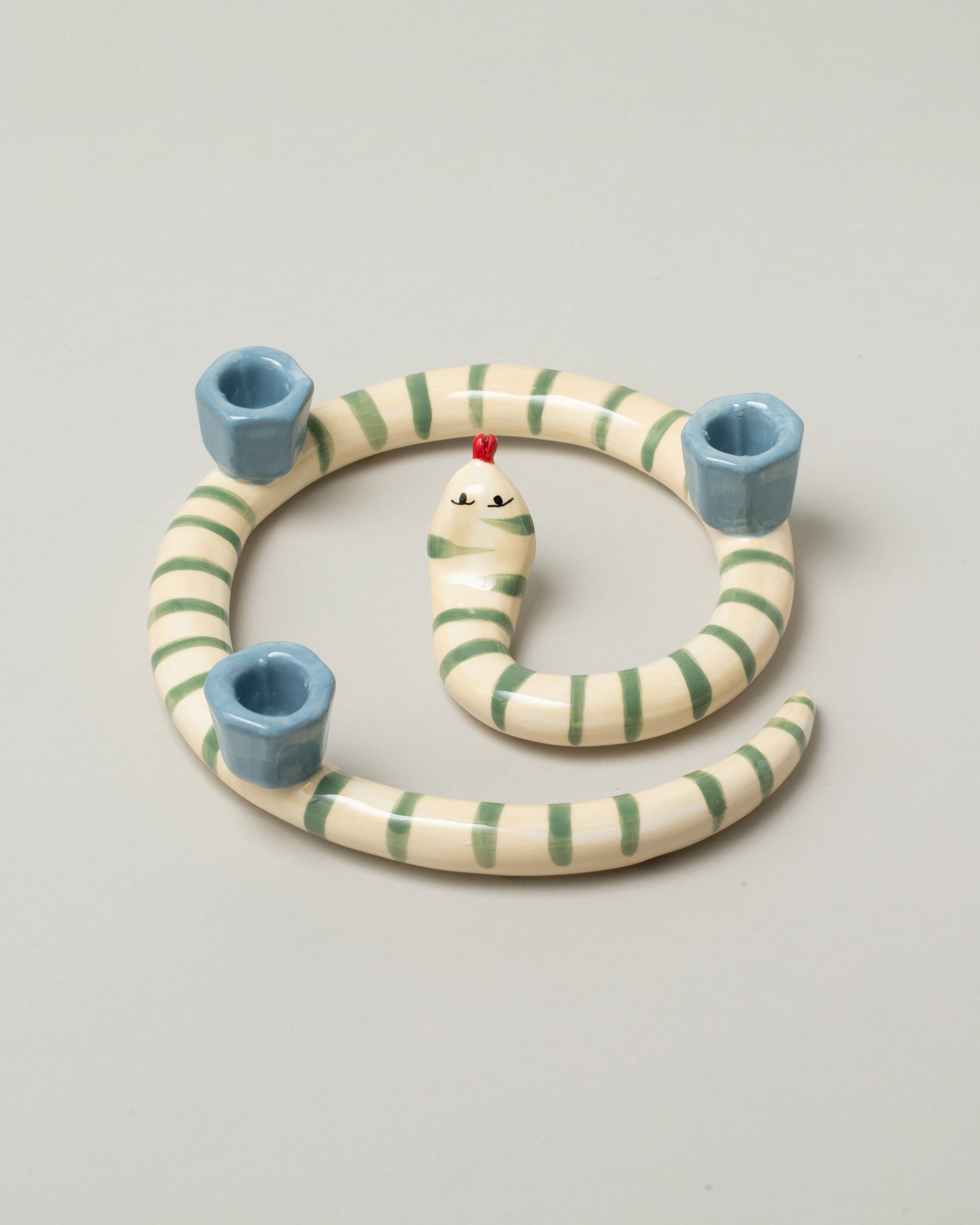 Laetitia Rouget Sneaky Stripes Snake Candle Holder on light color background.