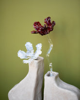 Styled image featuring the Alex Rosenbaum Ghost Glass Flower and Red Glass Flower with the Willem van Hooff Taro Medium Core Vessel.