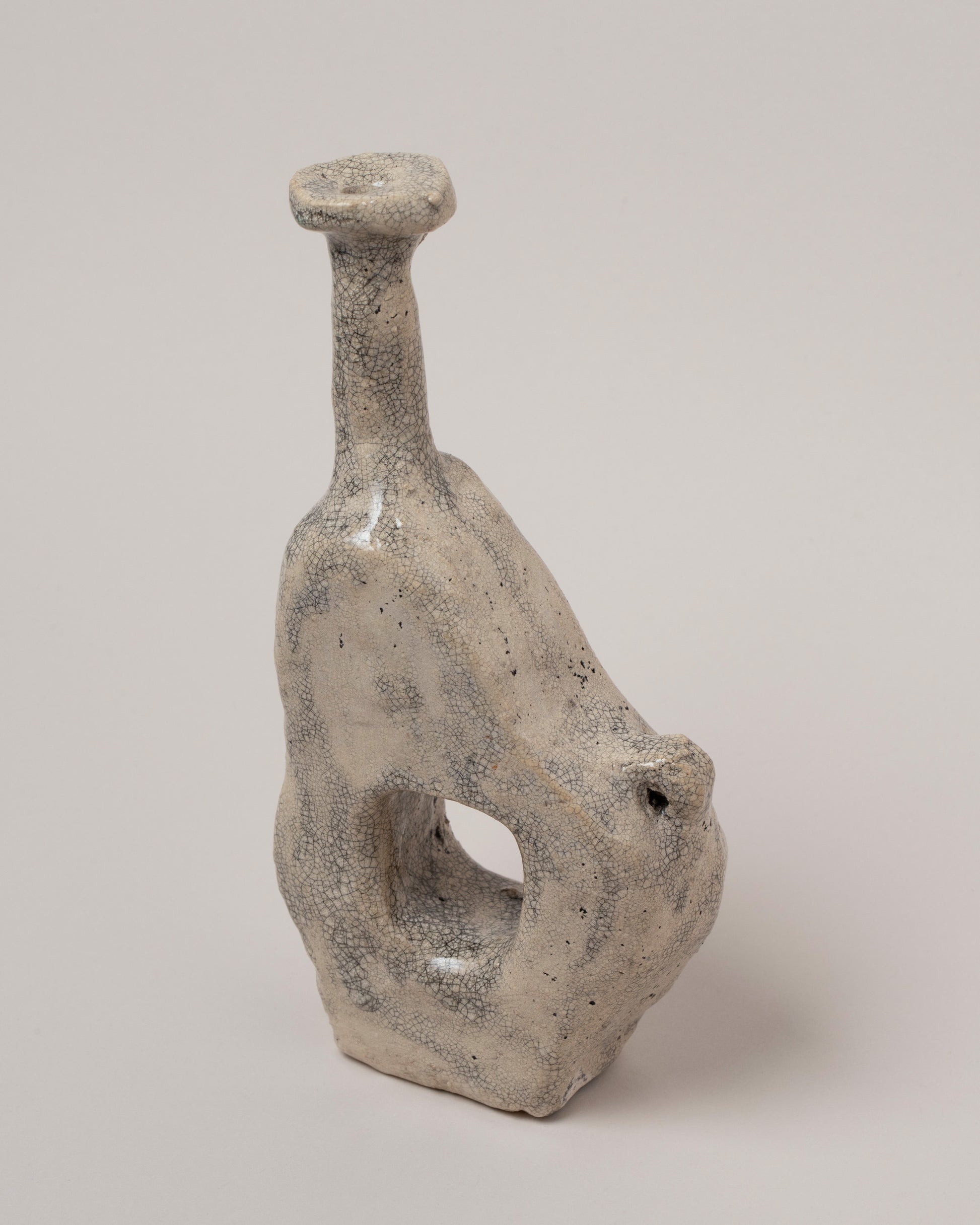 Closeup details of the Willem van Hooff Limestone Tiny Core Vessel on light color background.