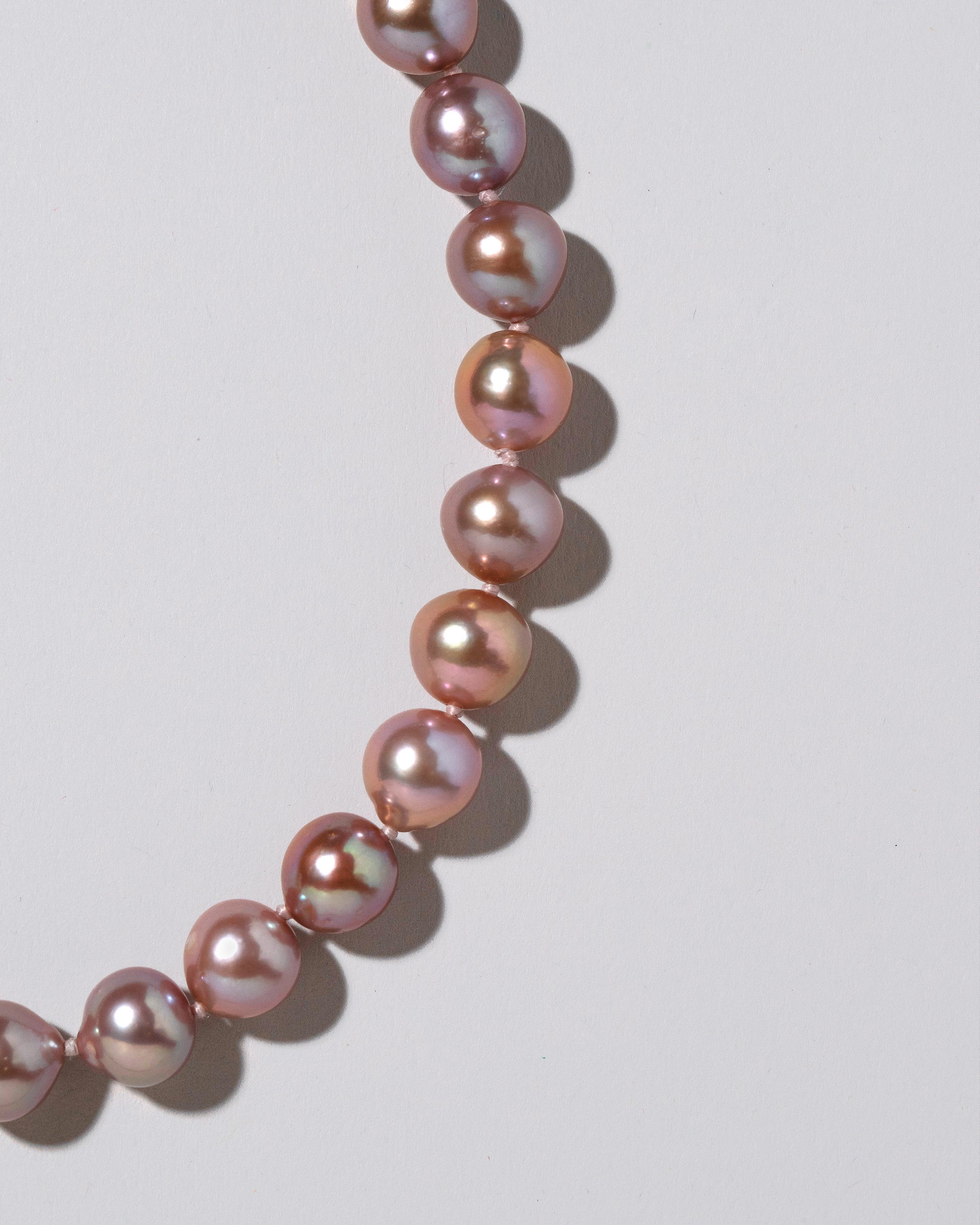 Cormorant Pearl Necklace on light color background.
