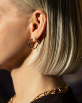 Gold Crimp Hoop Earrings on model.