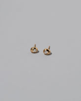 Diamond Birthstone Level Stud Earrings on light color background.