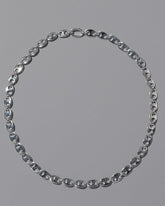 CRZM Sterling Silver Yuba Mini Necklace on light color background.