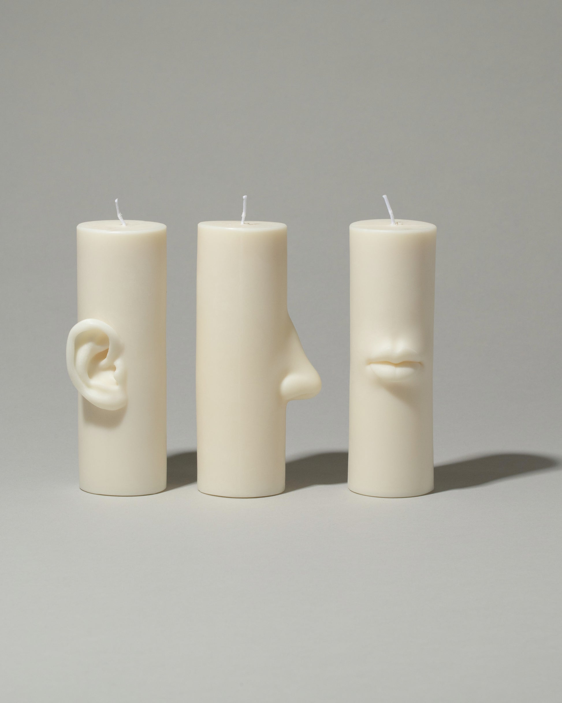 Bonam Kim Ear Pillar Candle, Lips Pillar Candle and Nose Pillar Candle on light color background.