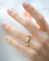 Gold Seeing Eye Band, Oval Diamond Transformation Ring and Gold Solid Bow Band on model.