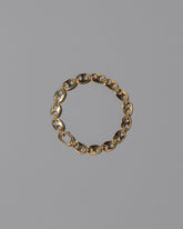 CRZM Gold Mini Yuba Bracelet on light color background.