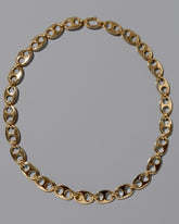 CRZM Gold Yuba Medium Necklace on light color background.