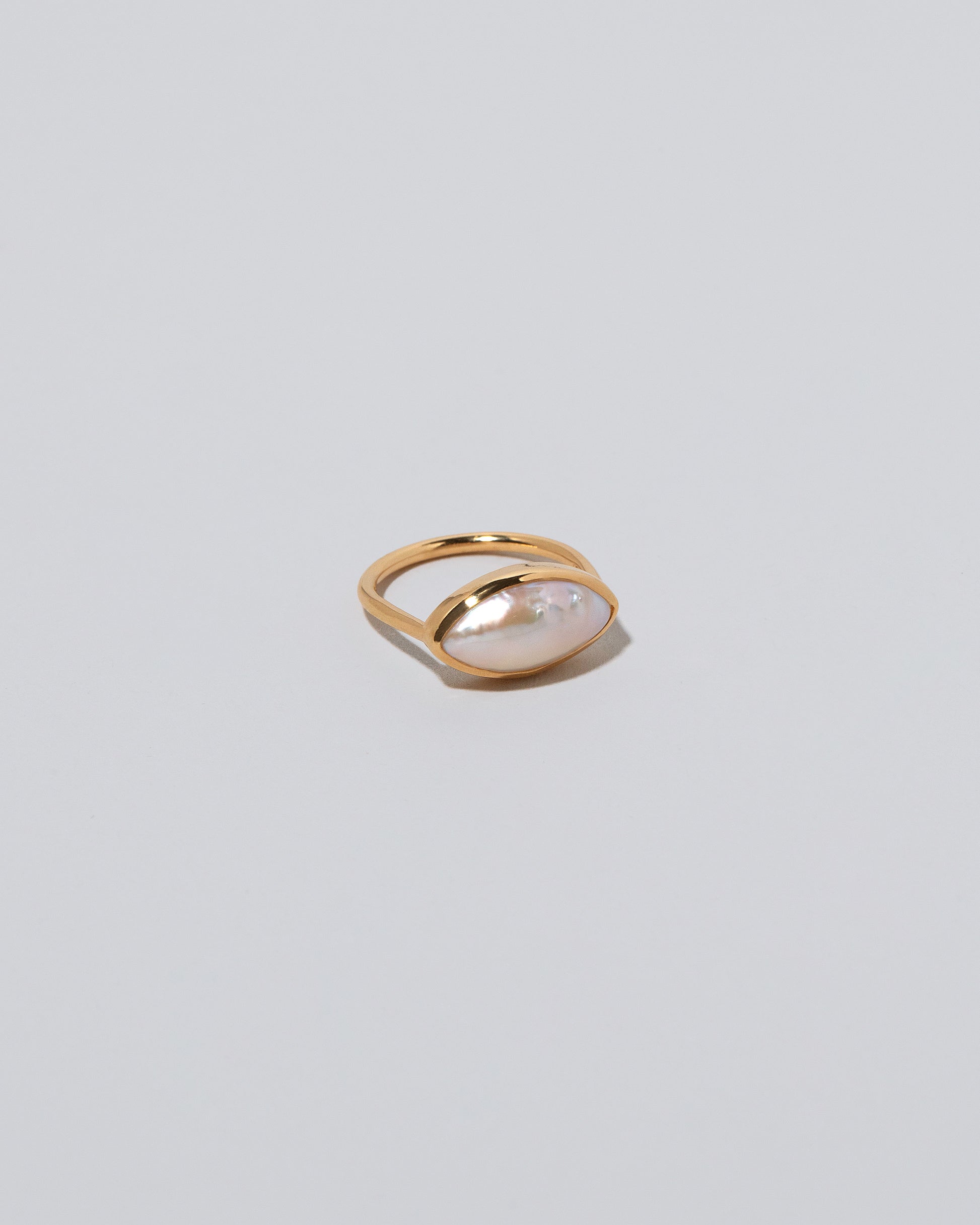 18k Gold Jacana Pearl Ring on light color background.