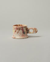 Echo Park Pottery by Peter Shire Round Handle Dusty Rose Splatter Mug on light color background.