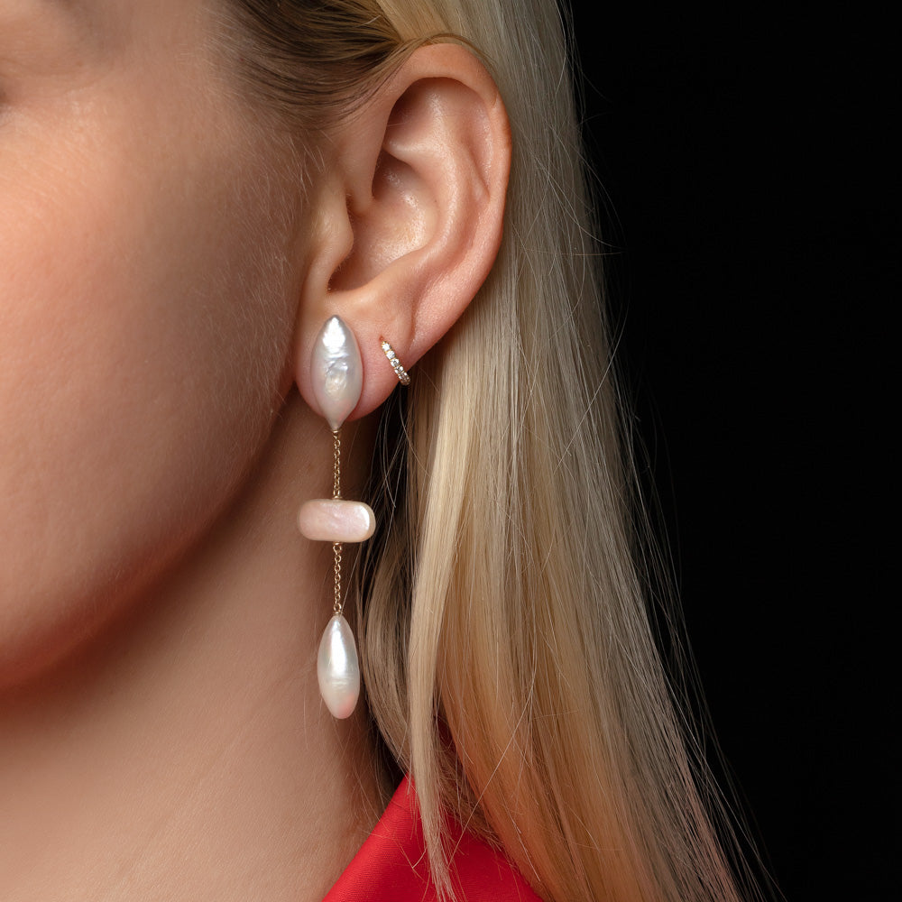 product_details::Osprey Pearl Earrings on model.