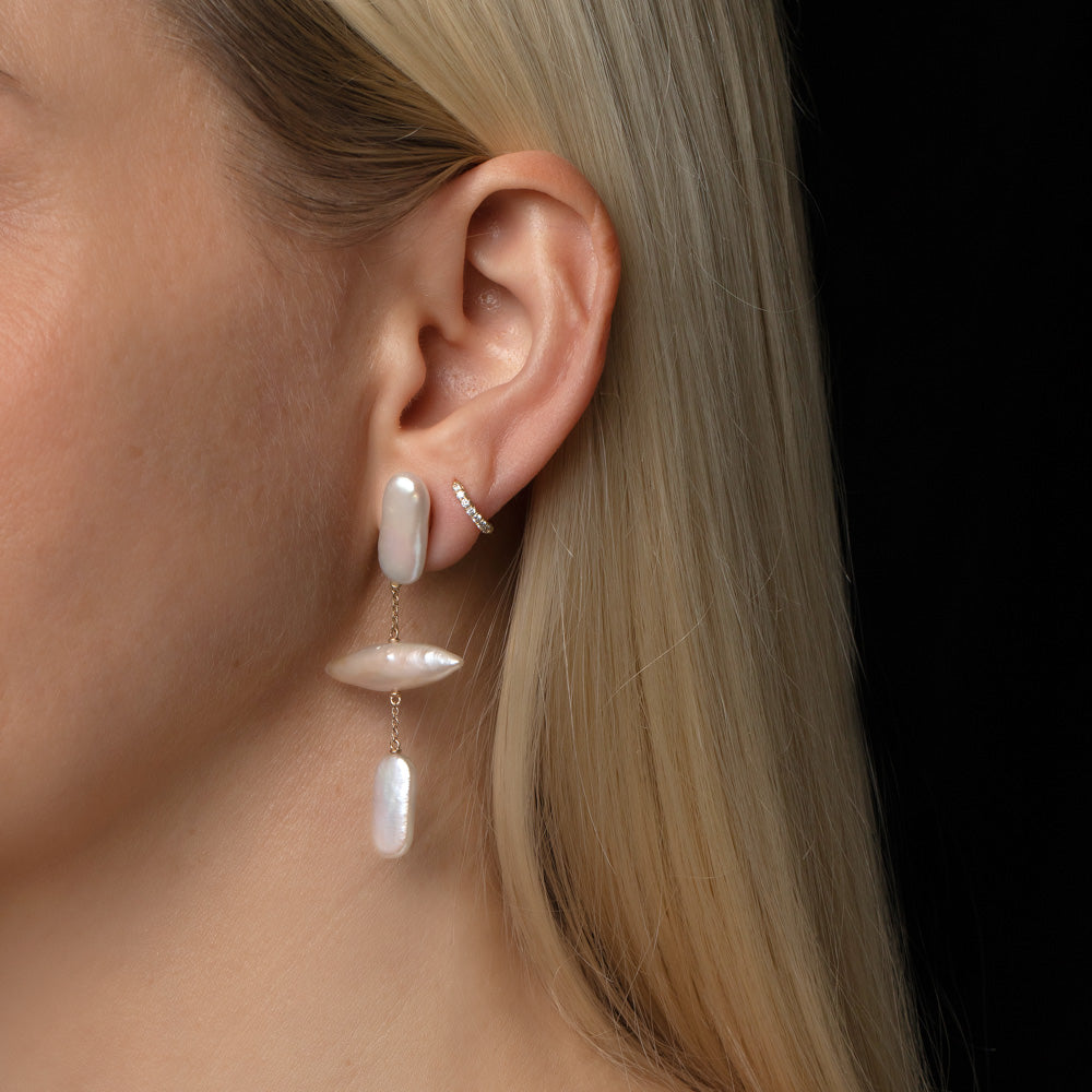product_details::Gull Pearl Earrings on model.