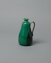 La Ceramica Vincenzo Del Monaco Green Samples & Imperfects Oil Bottle on light color background.