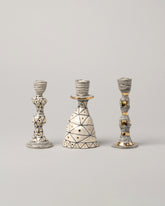 Group of Suzanne Sullivan Candleholders on light color background.