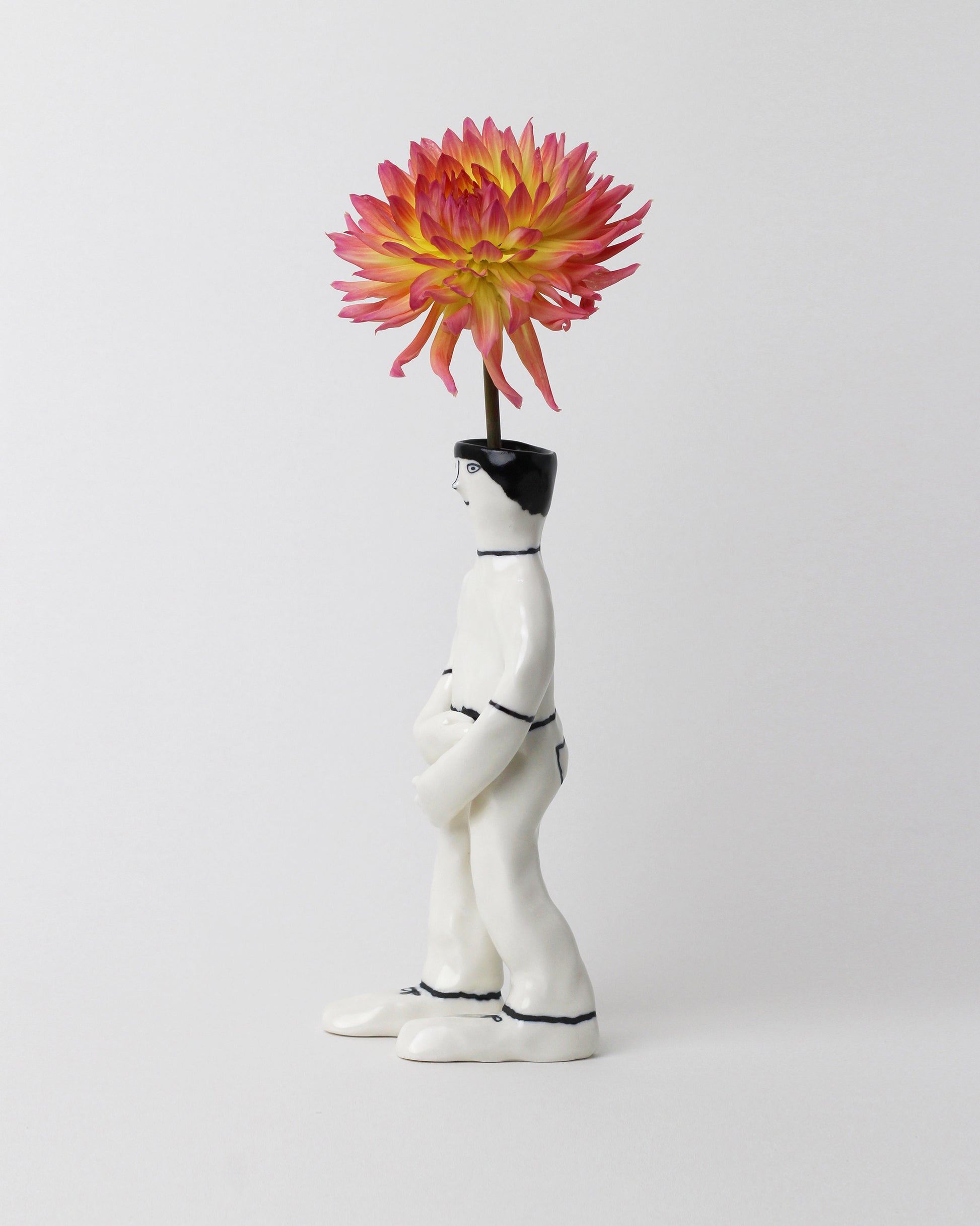 View from the side of the Eleonor Boström Walking PARK Guy Vase on light color background.