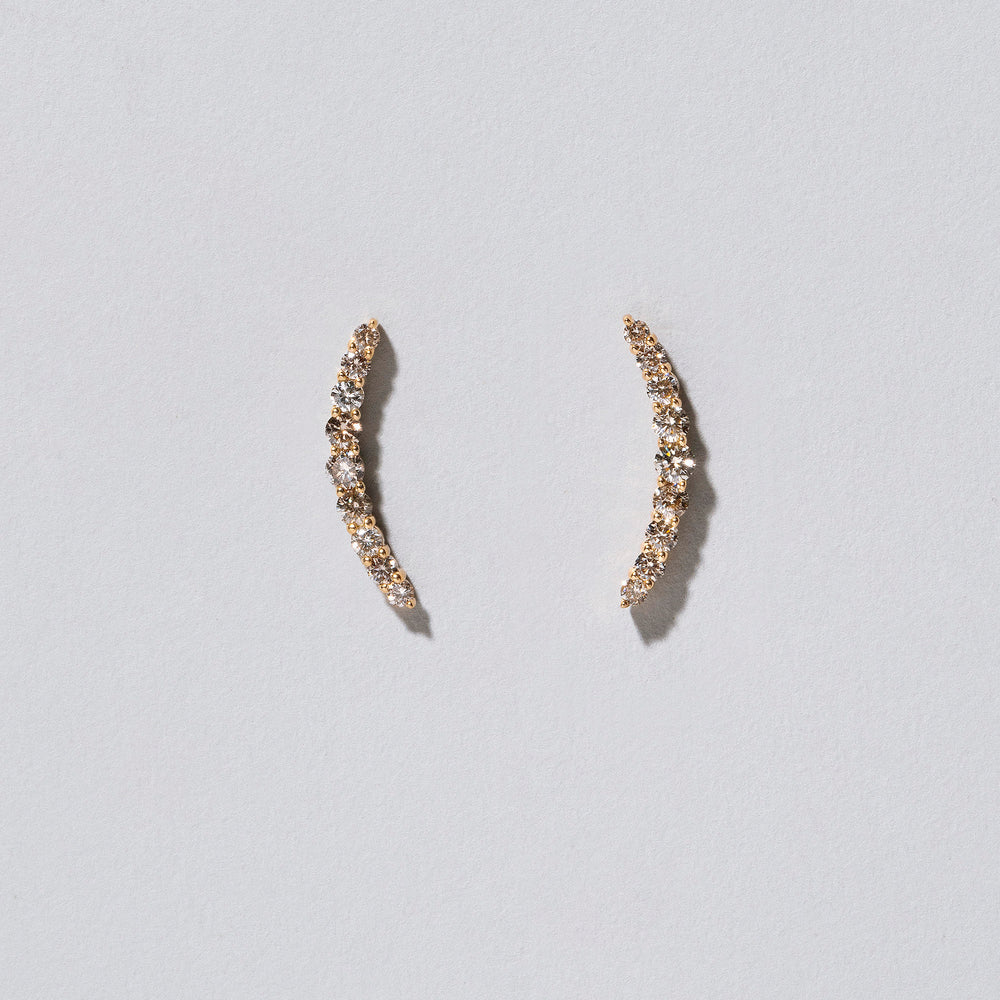 product_details::Crescent Ear Climber Stud Earrings - Champagne Diamond  on light color background.