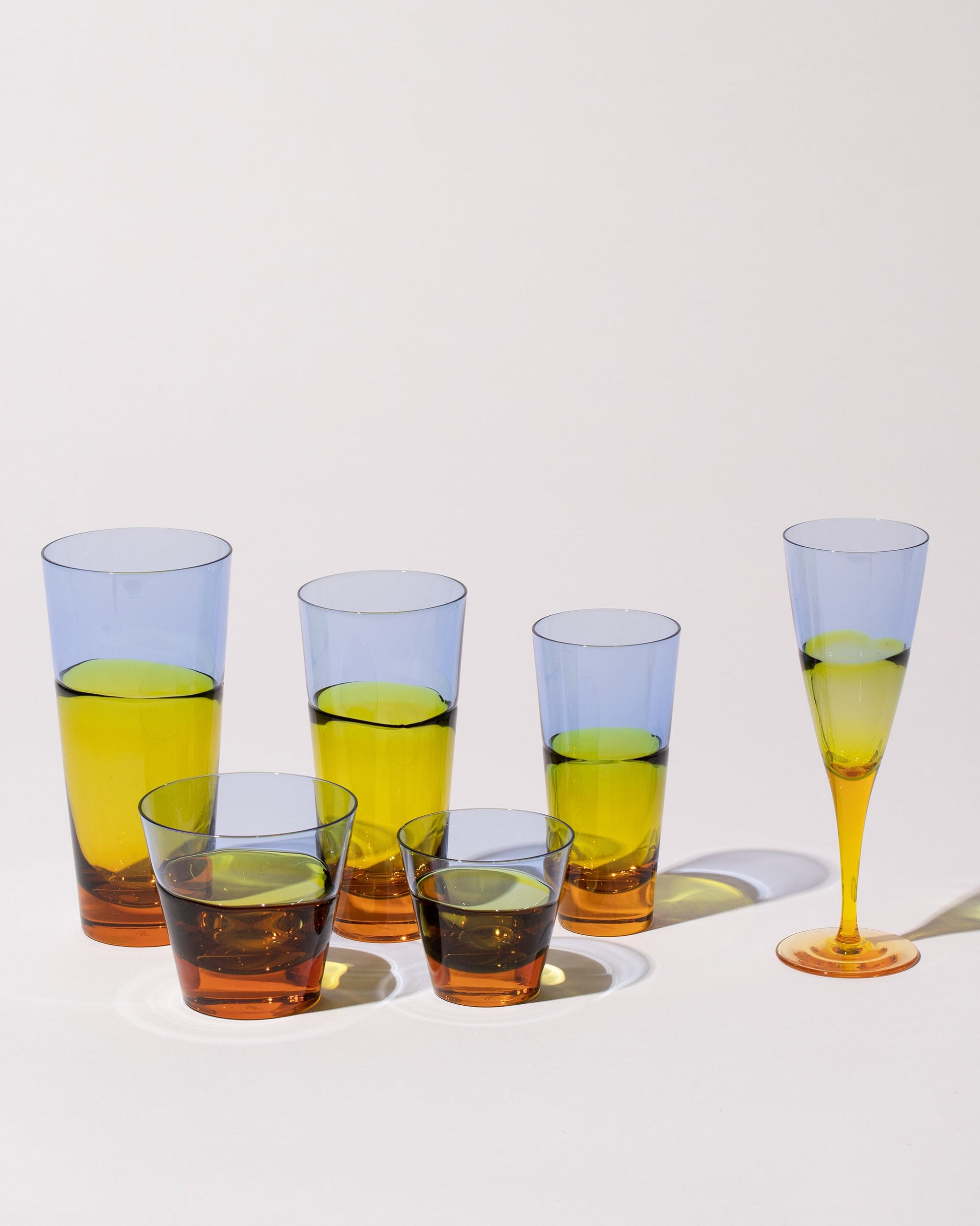 Group of Sugahara Glassworks Glassware on light color background.