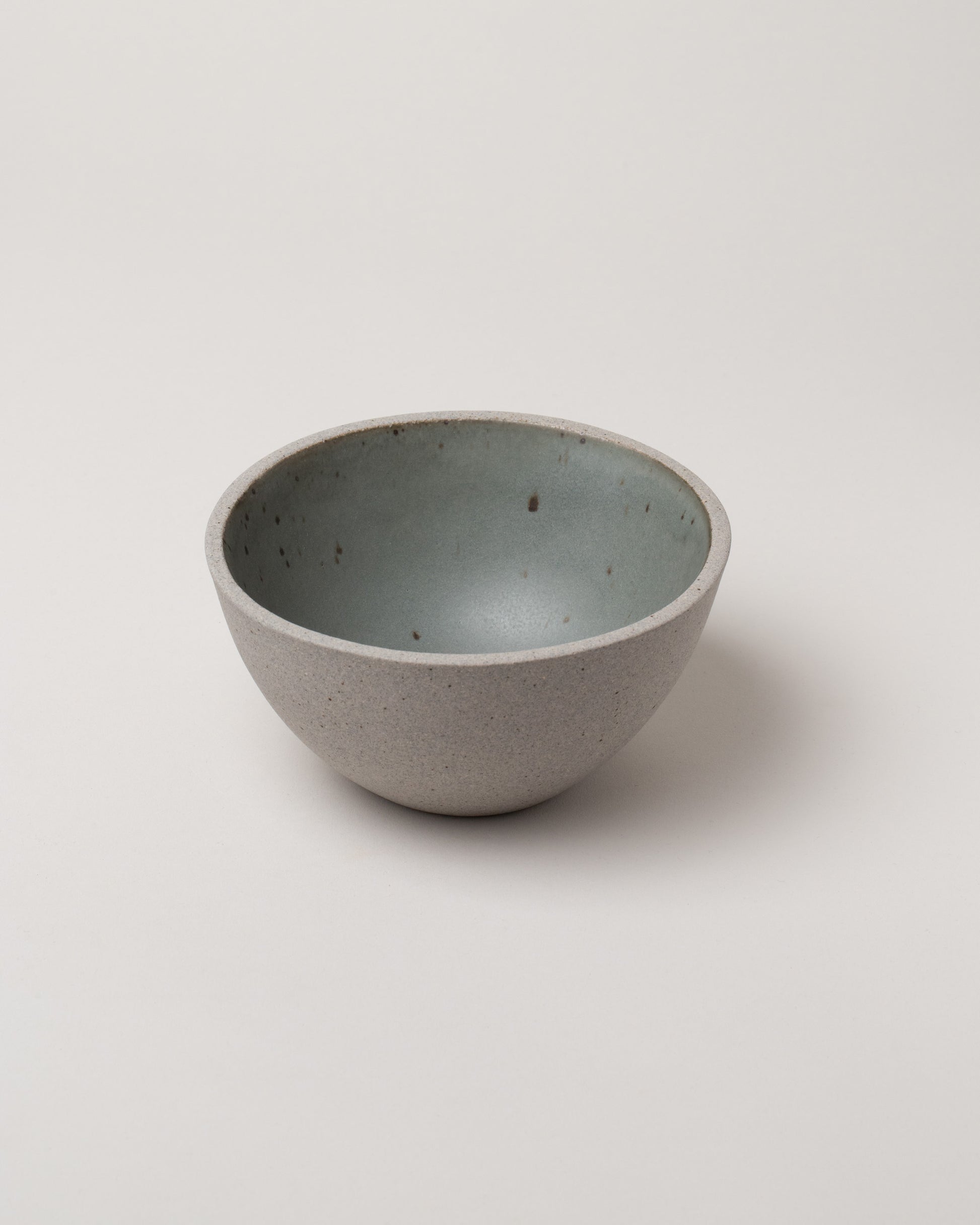 Humble Ceramics Greystone & Danish Pine Enoki Bowl on light color background.