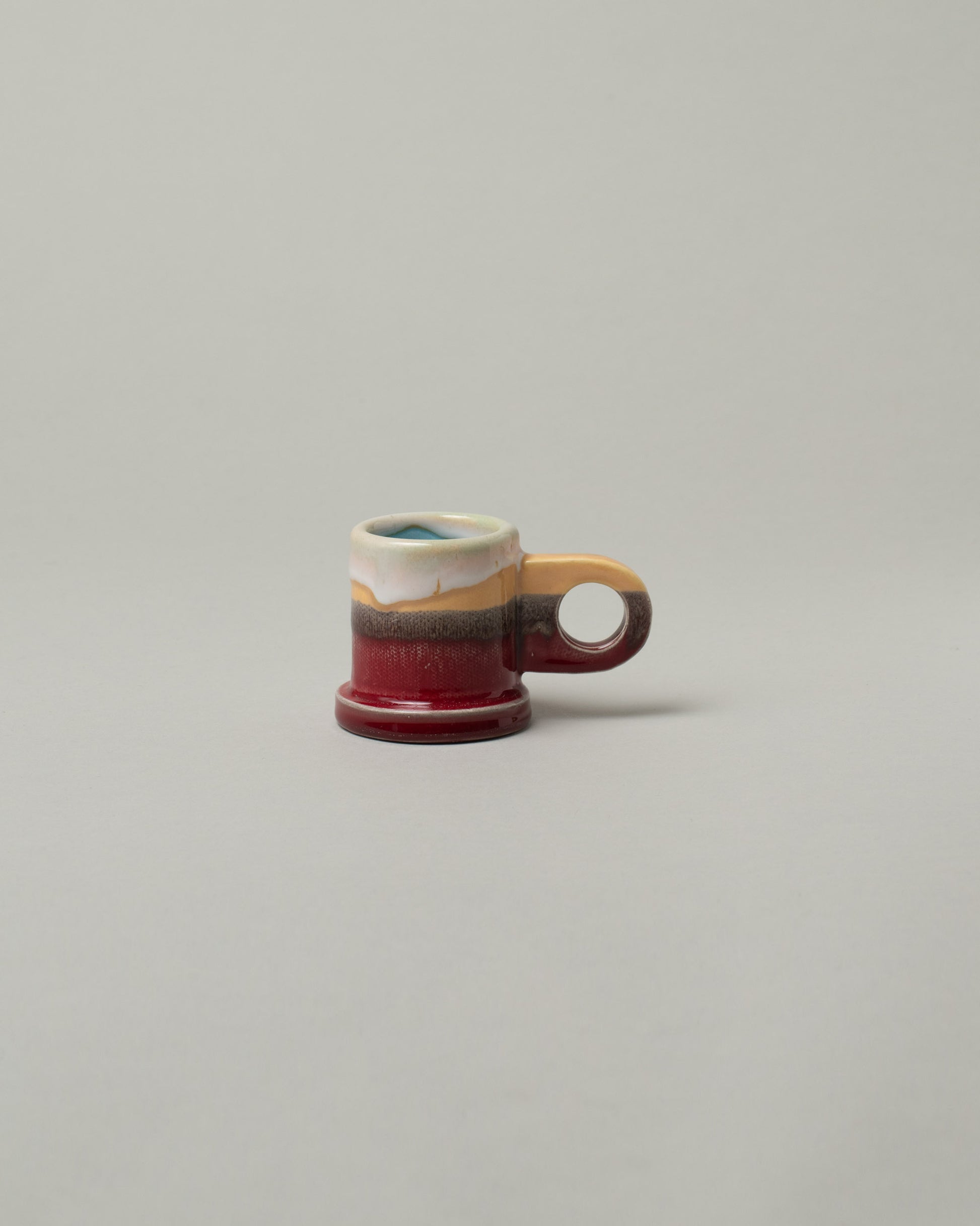 Echo Park Pottery by Peter Shire Ruby Double Dip Espresso Cup on light color background.